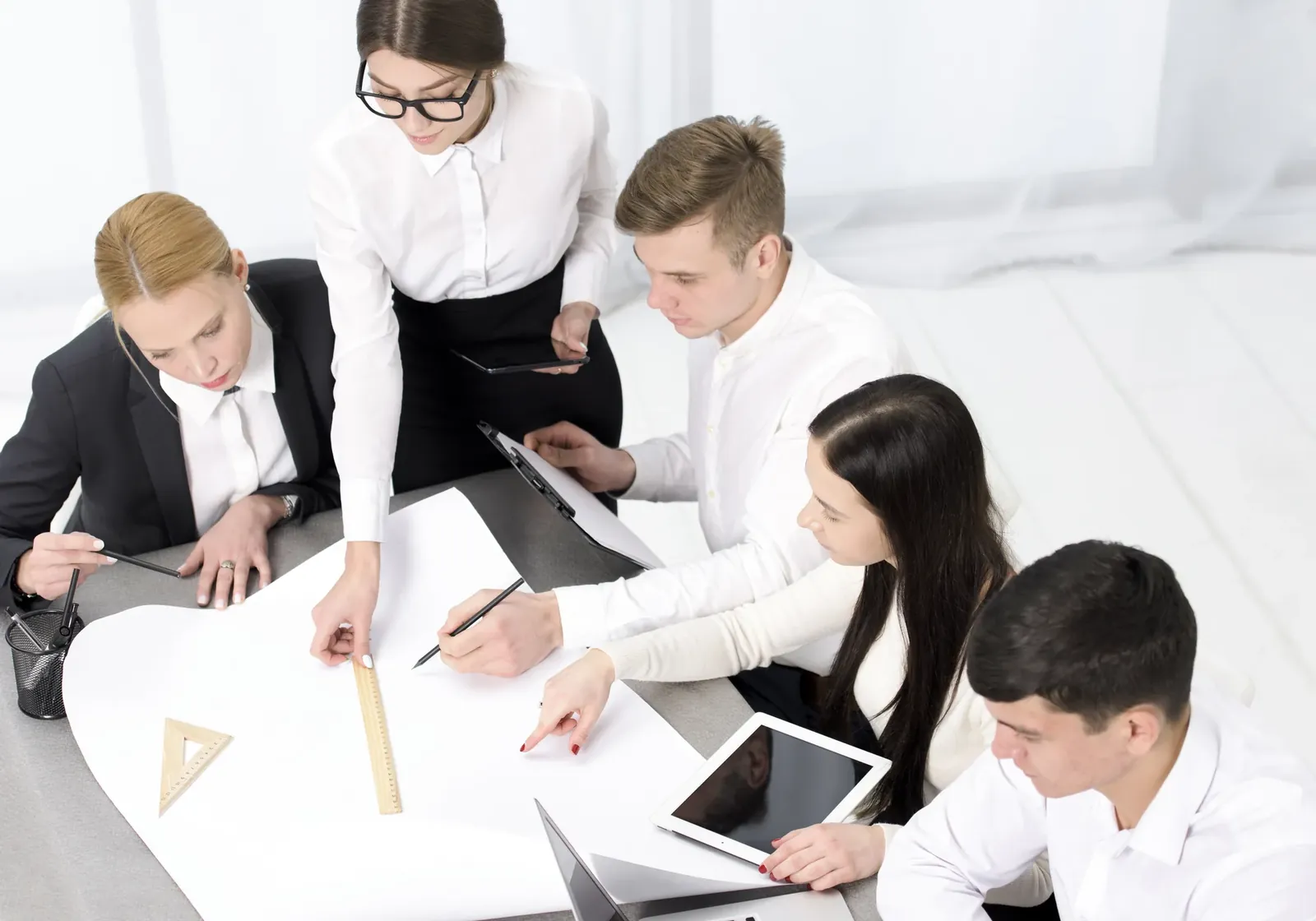 Collaborative business meeting reviewing budget and charts